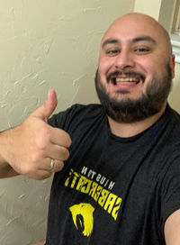 A man sitting on a toilet who is very excited. But not in that way. Like: the regular way.